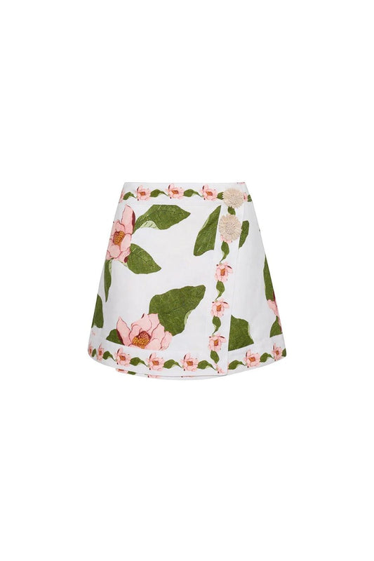 Bunny and Babe Winnetka Fischer mini wrap skirt in ivory linen with pink floral print and raffia trim.