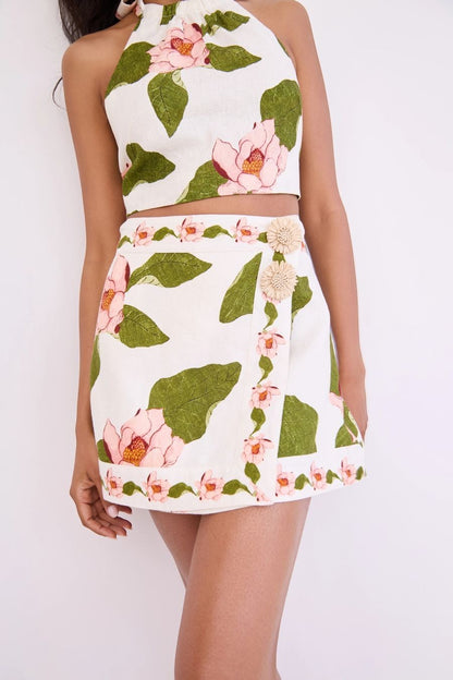 Bunny and Babe Winnetka Fischer mini wrap skirt in ivory linen with pink floral print and raffia trim.