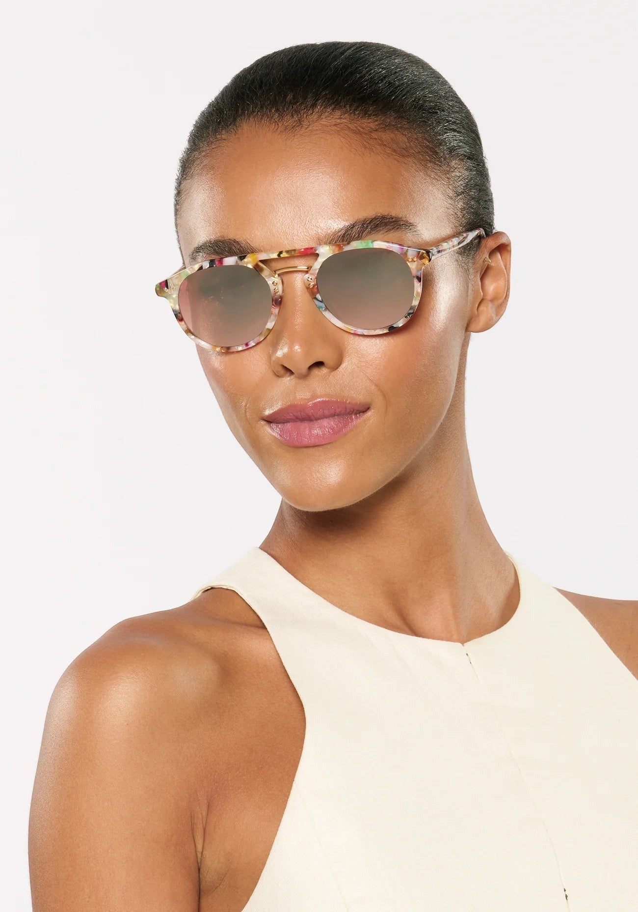 Bunny and Babe Winnetka Markle sunglasses with a multi-colored acetate frame, metallic bridge, and mirrored lenses.
