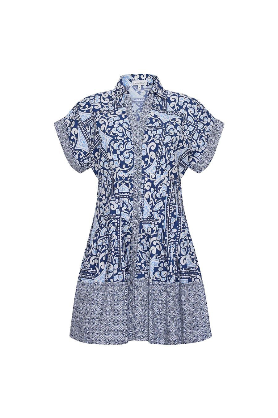Bunny and Babe Winnetka Nash Mini Dress in Hart Tile Navy. Blue and white patterned shirtdress with short sleeves, collared neckline, and tiered hem.