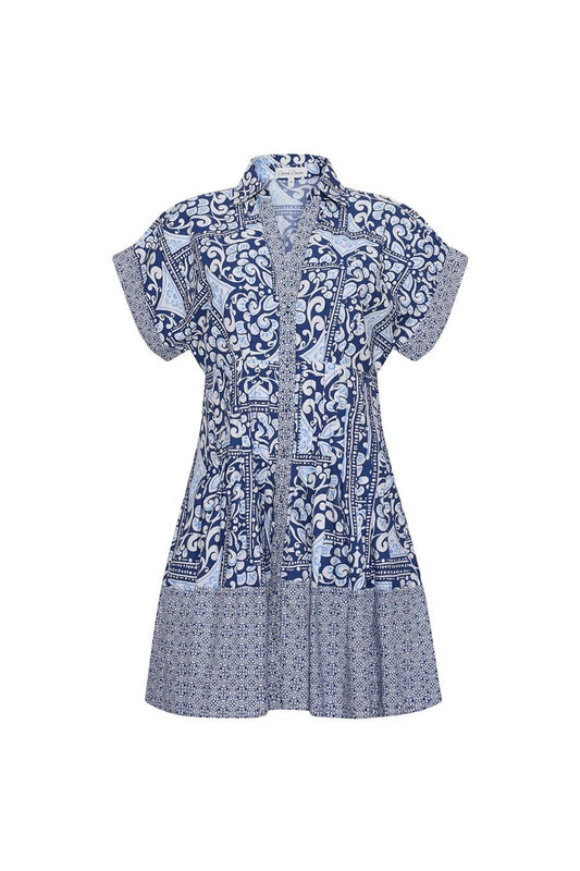 Bunny and Babe Winnetka Nash Mini Dress in Hart Tile Navy. Blue and white patterned shirtdress with short sleeves, collared neckline, and tiered hem.