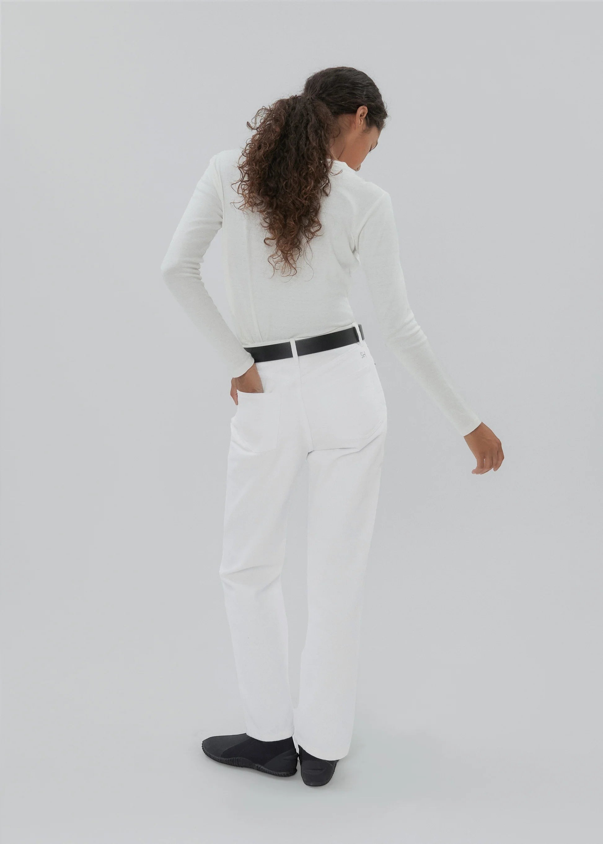 Bunny and Babe Winnetka white 100% cotton high-rise straight-leg jeans with button fly and signature embroidery.
